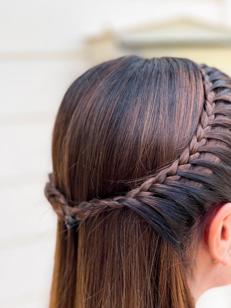 Long French braided to the back starting at
